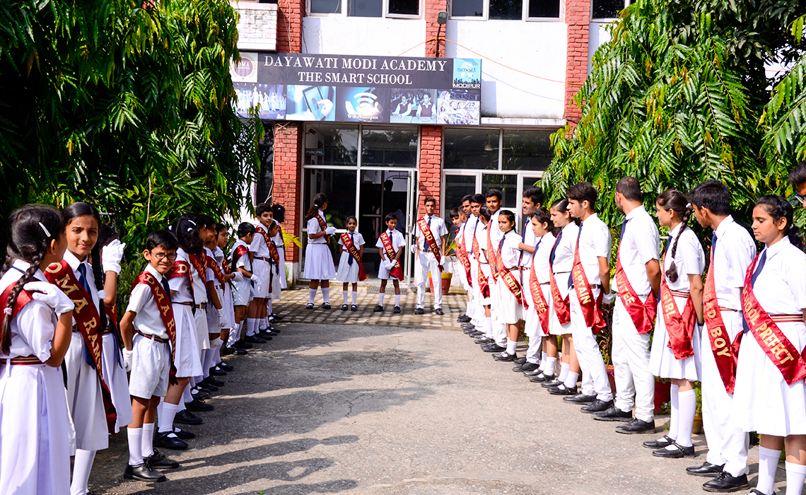 Students of DMA, Modipur await chief guests at their Sports day